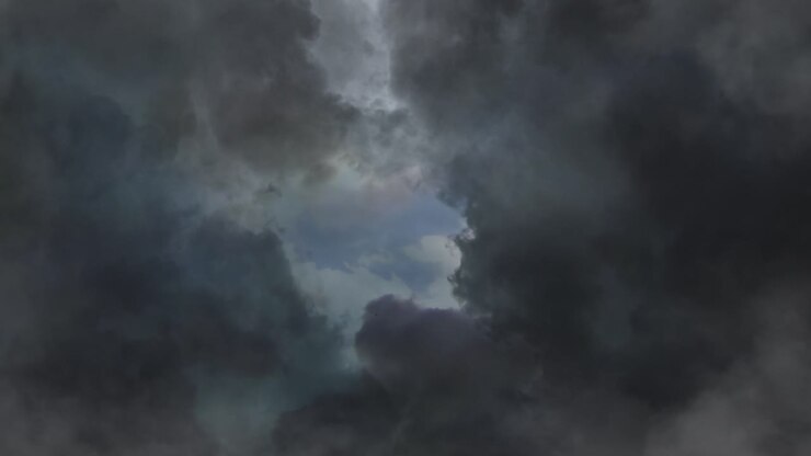 point of view thick clouds in the blue sky and lightning bolts in them