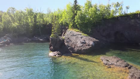 Camera-going-backwards-reveling-a-beautiful-landscape-in-Minnesota-Lake-Superior-North-Shore-during-a-summer-sunny-afternoon