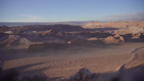 high angle view looking down at wind blowing atacama desert dust above the ground