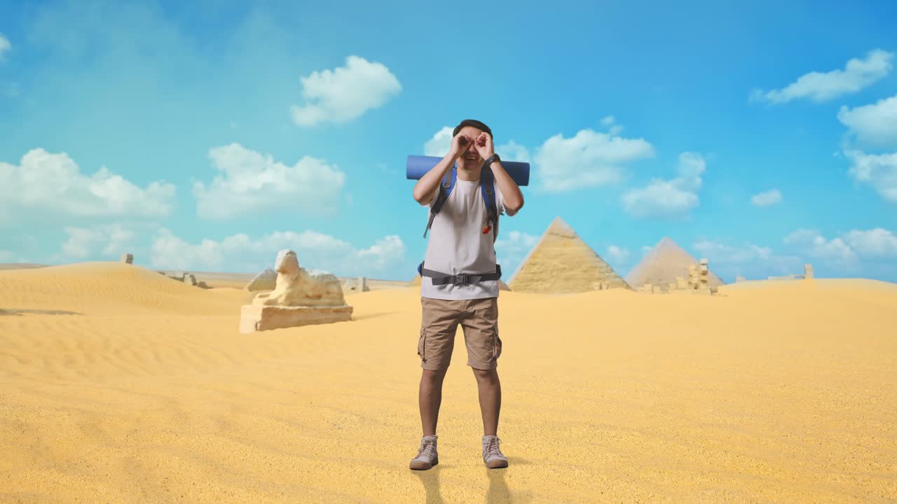 Full Body Of Asian Male Hiker With Mountaineering Backpack Making Binoculars Gesture Looking At Something Then Saying Wow While Traveling In Pyramid Of Giza