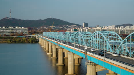 Dongjak-Bridge-Car-Traffic-and-Subway-Train-Movement-at-Daytime-with-view-of-N-Seoul-Namsan-Tower-Time-lapse