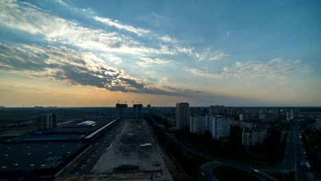 the beautiful city on the sunrise background. day to night view. time lapse