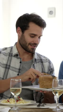 friends interacting while having a meal