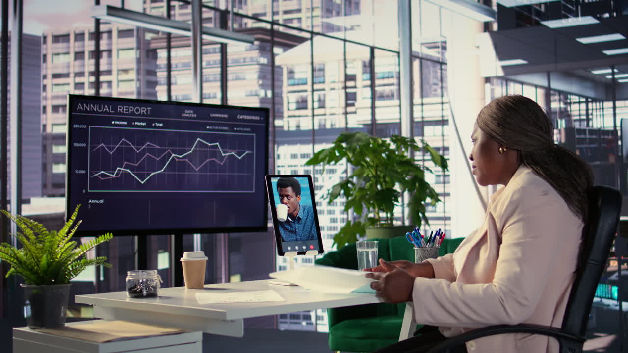 Businesswoman in Video Conference Reviewing Annual Report