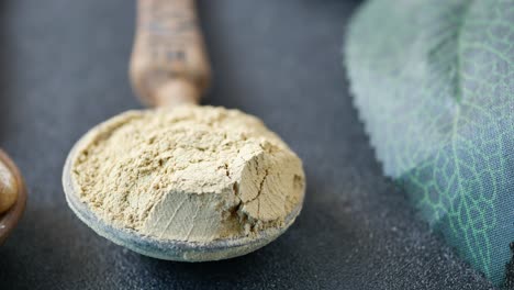 herbal medicine capsule and leaf on white