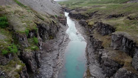 areal shot of the studlagil canyon in icelend on a cloudy day