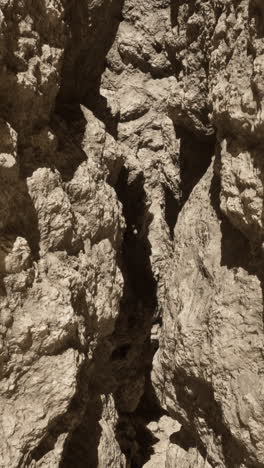 a narrow canyon with steep rock walls