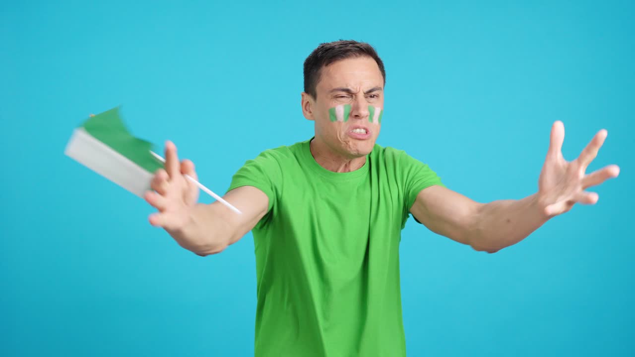 Man Cheering for Nigeria, angry with the decision of referee