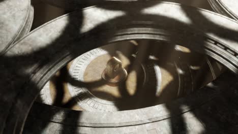 3d animation of an old style clock placed in the middle of a secret tomb view from above