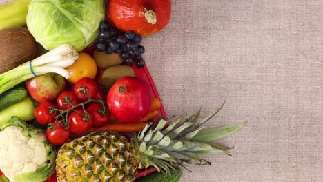 fresh fruits and vegetables appear in red tray on left side of theme. stop motion