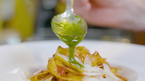 cook preparing pasta dish in italian restaurant 3