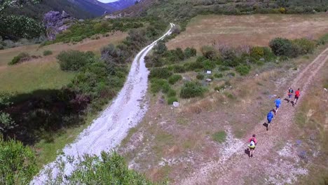 People-running-in-group-in-the-nature-aerial-shot