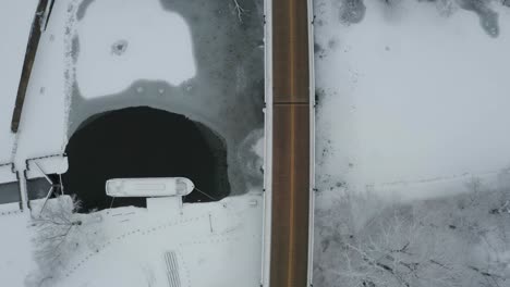 Two-lane-road-bridge-in-top-down-aerial-drone-view