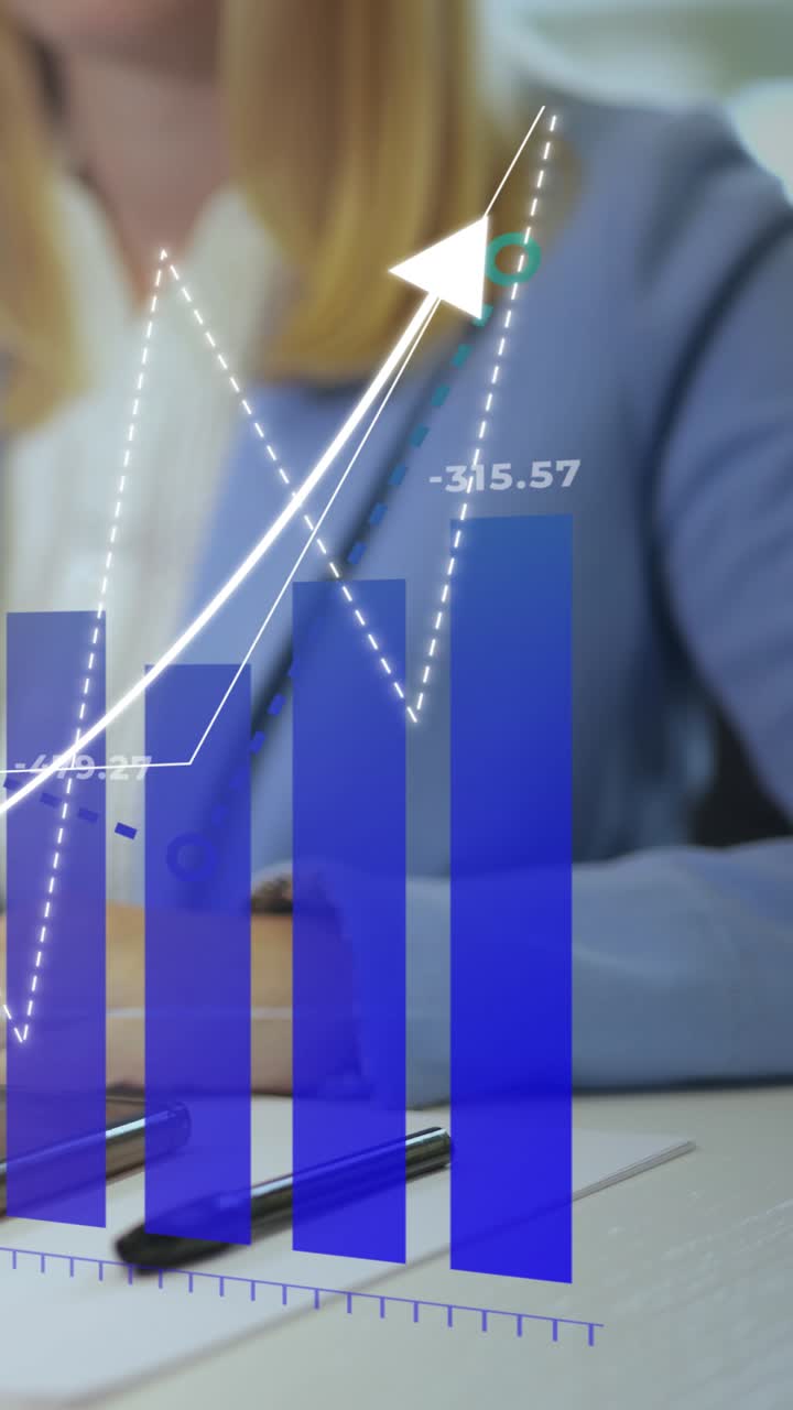 Vertical View Of Businesswoman At Her Desk, With Holographic Charts And Graphs Overlayed, Symbolizing Analysis And Strategic Planning