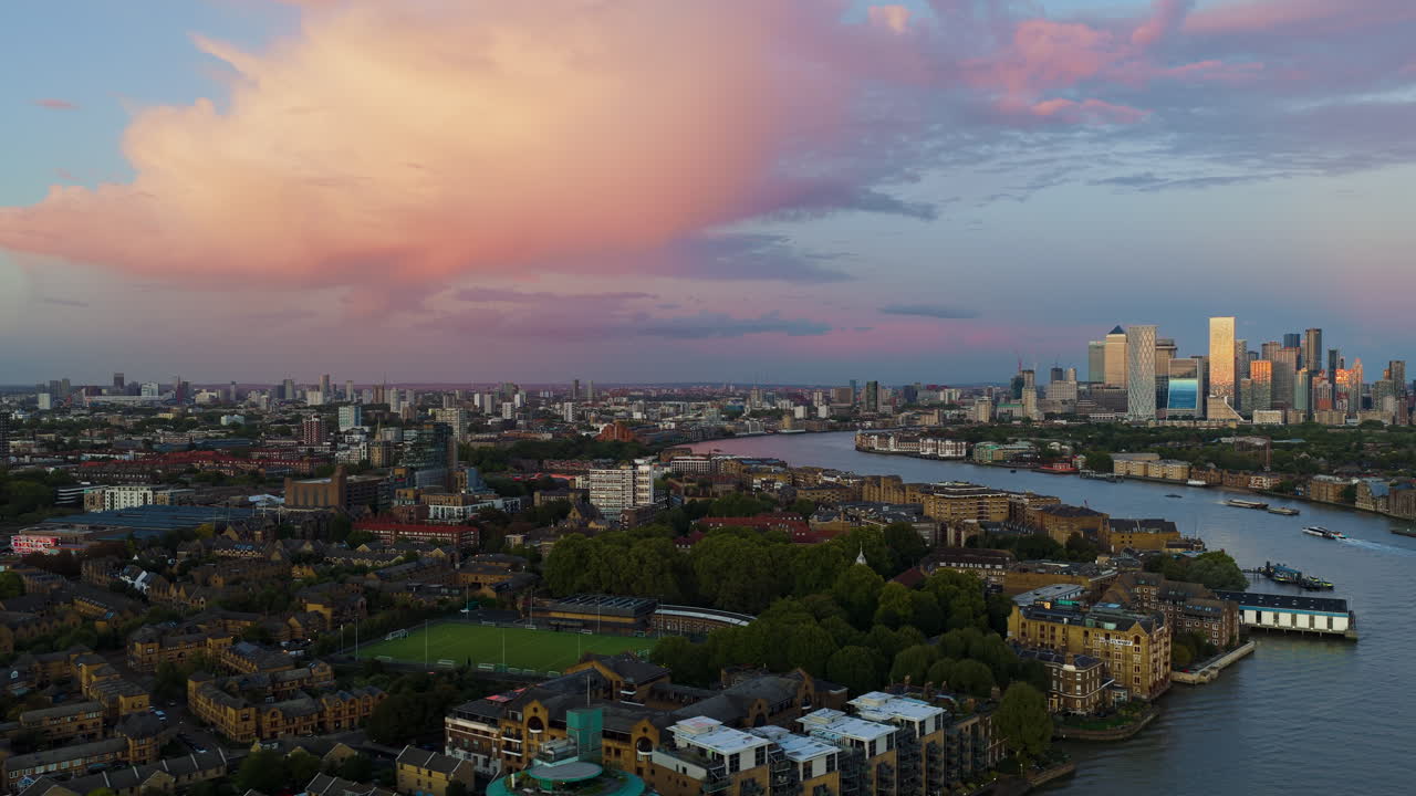 Cityscape with River and Skyscrapers at Sunset