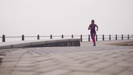 caucasian woman running on the docks