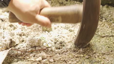 hammering through thin layer of concrete