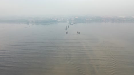 fishing boats in a foggy coastal village