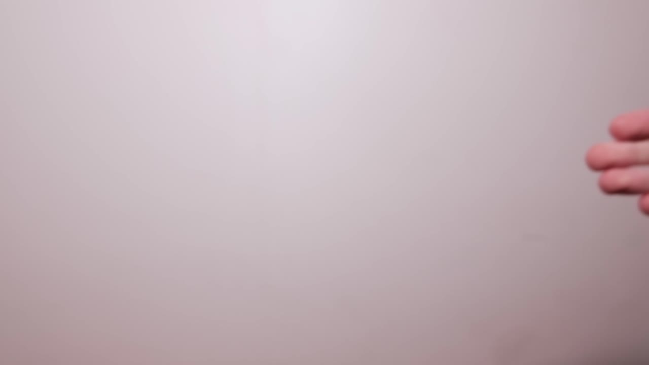 Two business men shaking hands on the white background. Close up