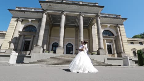 wedding day. wedding session. wedding couple posing before the old building in sunny day
