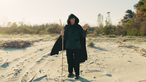 elderly sorcerer arriving at the sea in the morning