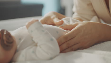 mother gently caring for newborn baby