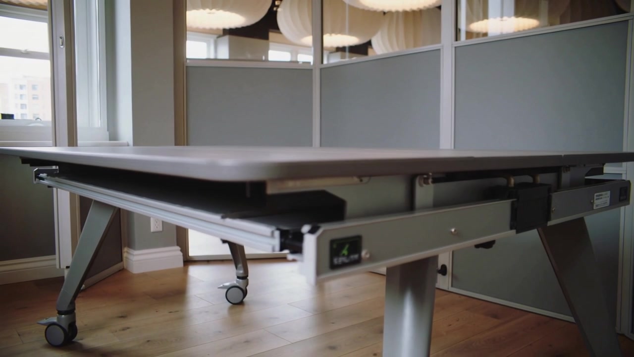 Control box activating table's underside, slide-out rail and tray extending for access at office