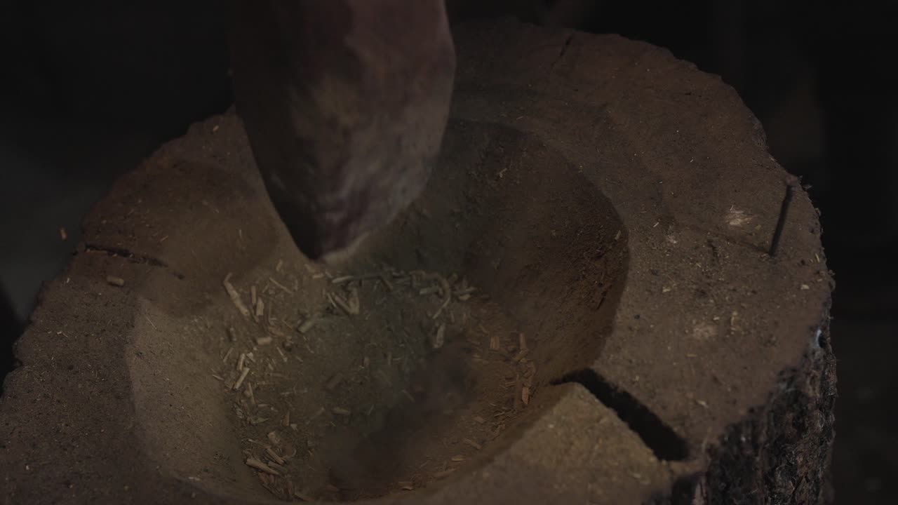 Traditional Yerba Mate Grinding with Mortar, Cultural Herbal Preparation Process