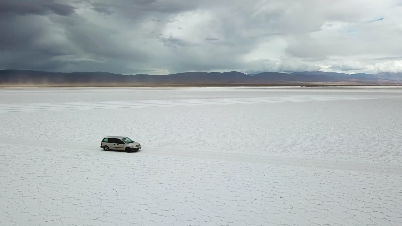 Solitary 4x4 Van Vehicle in Massive White Salt Flat Under Dramatic Sky. Salinas Grandes, Salta, Argentina
