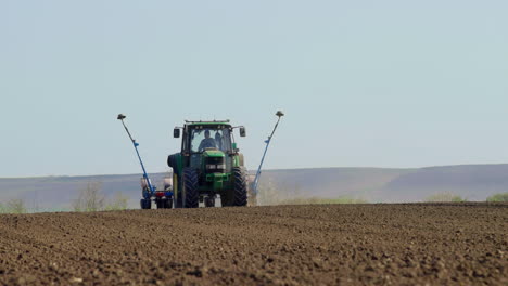 tractor planting crops in a field