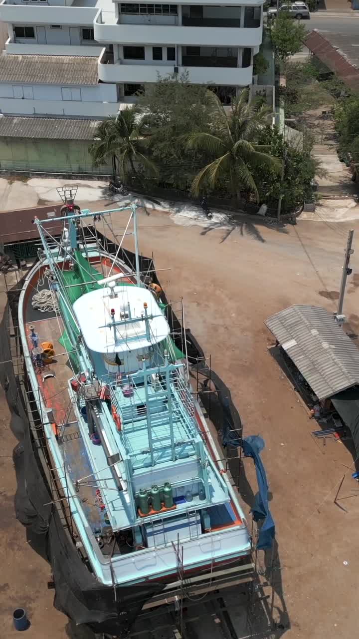 Fishing boats under construction and repair in a shipyard