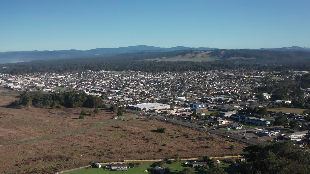 Aerial wide panning shot of Fort Bragg as seen from the Noyo River in Northern California. 4K