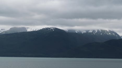 beautiful alaskan scenery. sailing the gastineau channel on a cloudy and rainy day to juneau.