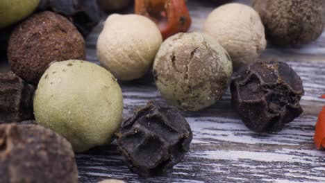 macro close-up mixed peppercorns. dry mix peppercorns close up