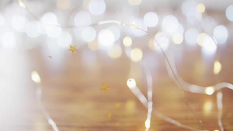 twinkling lights and stars animation over blurred wooden surface background