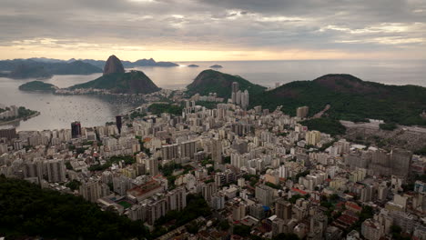 high sunrise drone view over botafogo in rio toward iconic sugarloaf mountain