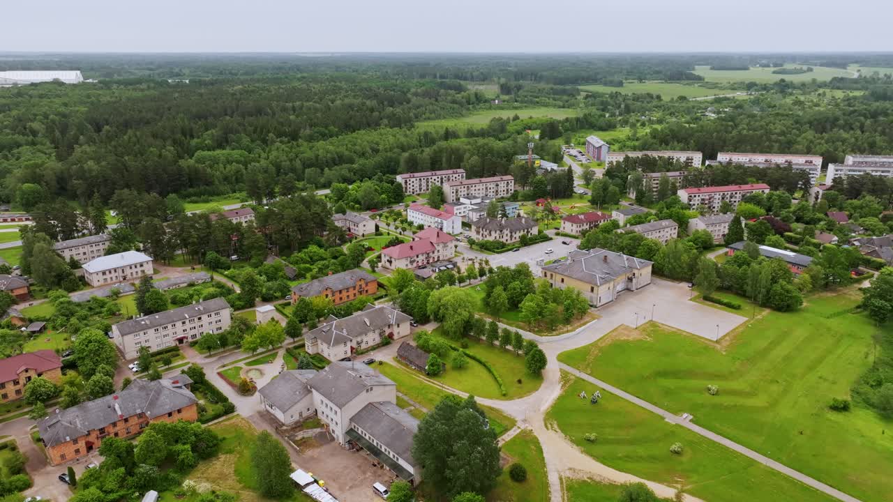 Fast Drone Orbit Over Broceni Town In Latvia With Green Landscape And Industry