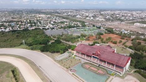 Aerial-birds-eye-shot-over-racecourse-in-Santo-Domingo-during-sunny-day,Dominican-Republic