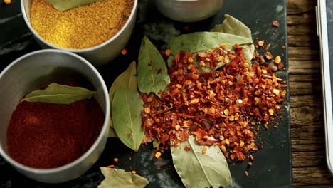 various spices on concrete tray 4k