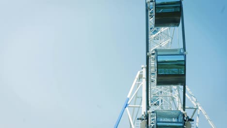 ferris wheel against blue sky