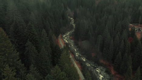 misty mountain valley with river and road