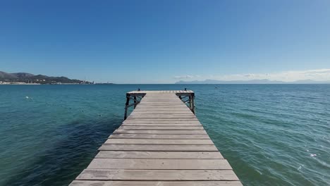 tranquil wooden pier extending into the calm sea