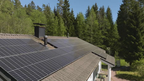Aerial view of a roof full of solar power modules, sunny, summer day in Finland