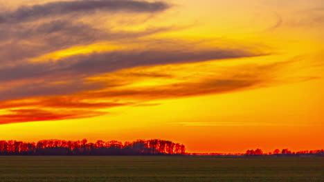 a breathtaking display of golden hour light illuminating the sky with rich, warm colors, casting gentle shadows across the serene landscape