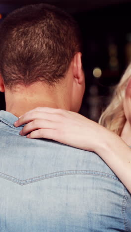 young couple hugging with a gift