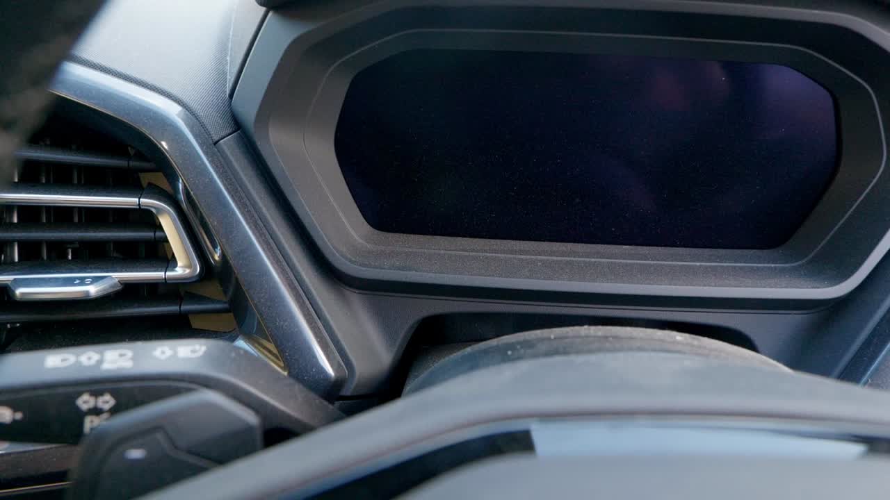 Dusty SUV steering column, instrument cluster and dash screen - medium close up - pan truck left to right