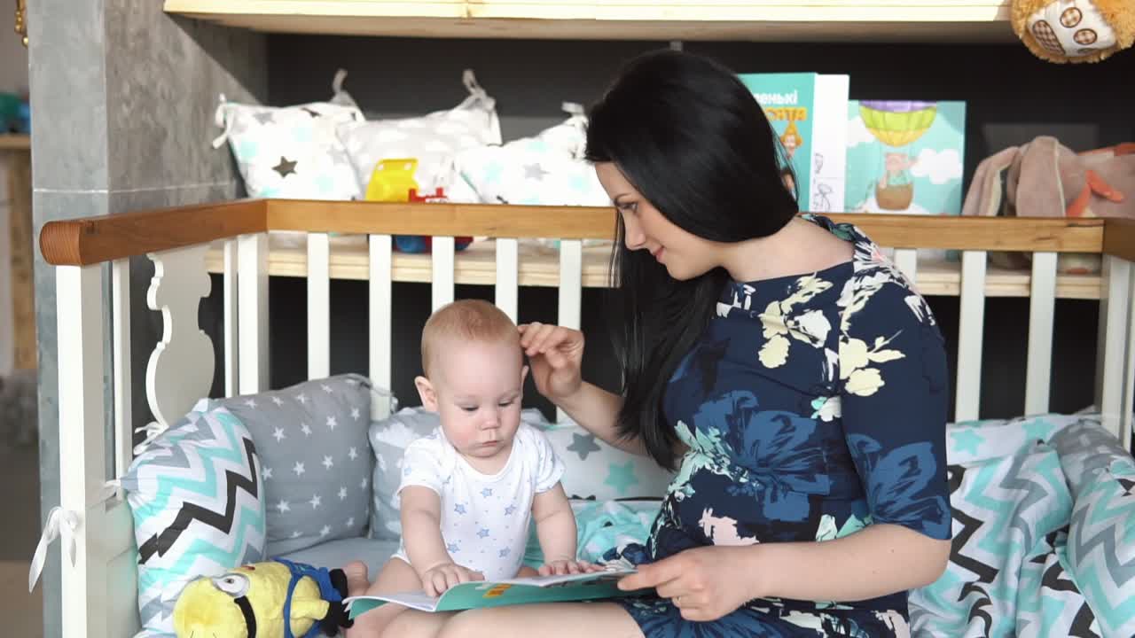 Mother and Baby Reading in Crib