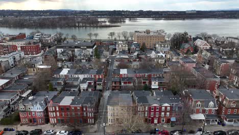 high aerial truck shot of houses in harrisburg, pennsylvania with susquehanna river in background