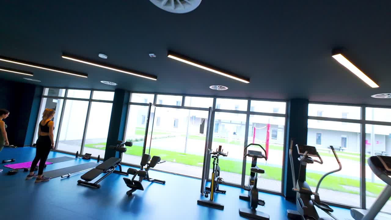 Empty Playing fields, gym, swimming pool in Student Living Campus X or CX Milan, Novate Milanese, Italy. Aerial drone FPV