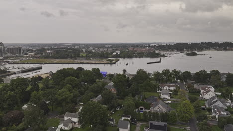 stamford connecticut aerial v4 flyover charming waterside neighborhood capturing long island sound and south end cityscape with new property developments - shot with mavic 3 pro cine - october 2023